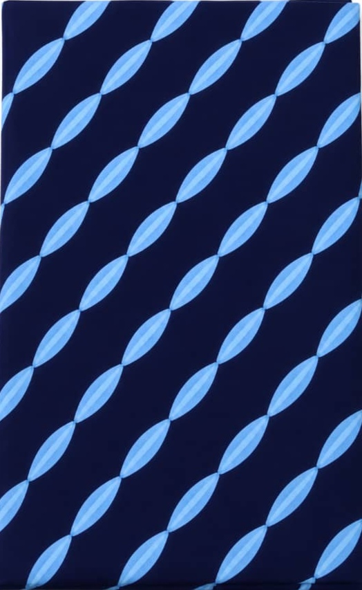 Deep indigo-dyed Adire cloth showing hand-applied cassava starch resist patterns, produced by Yoruba women in south-western Nigeria.